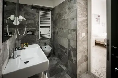 a bathroom with a sink and a toilet at Vinci House in Rome