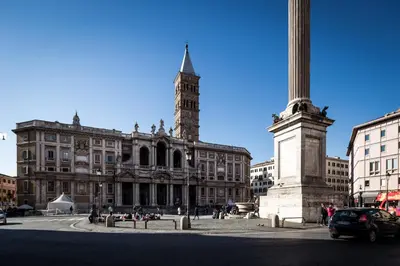 a large building with a clock tower and a pole at Vinci House in Rome