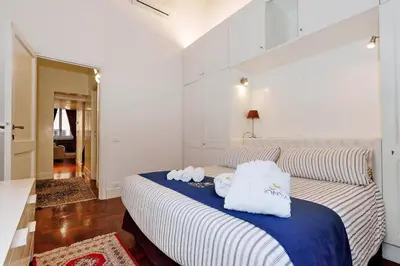 a bedroom with two towels on a bed at Pantheon Family Junior Suite in Rome