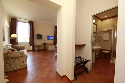 a living room with a couch and a sink at Residenza Gens Julia in Rome