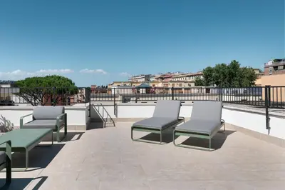 a group of chairs sitting on top of a roof at AC Hotel by Marriott Clodio Roma in Rome