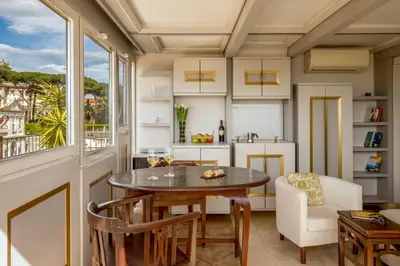 a kitchen and dining room with a table and a window at Lf View in Rome