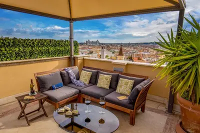 a living room with a couch and a table at Lf View in Rome