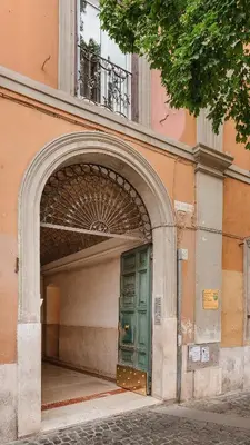 an entrance to a building with a green door at Etruska luxury Trastevere Guesthouse in Rome