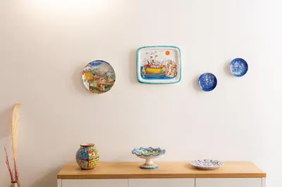 a wall with plates and vases on a wall at Rental in Rome - Bramante Luxury in Rome