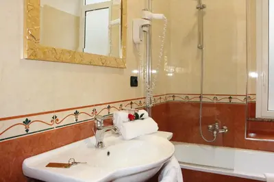 a bathroom with a sink and a shower at Guest House Galaxy in Rome