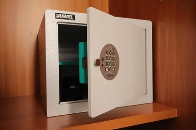 a microwave on a shelf with a remote control at Hotel Principe Eugenio in Rome