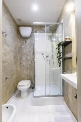 a bathroom with a shower and a toilet and a sink at La Vite Vaticana in Rome