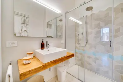 a bathroom with a sink and a shower at Beautiful designer apartment close to Pantheon in Rome