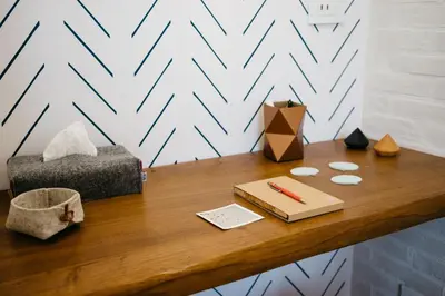 a desk with a pen and a box on it at Beautiful designer apartment close to Pantheon in Rome