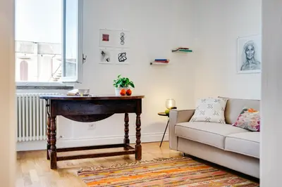 a living room with a table and a couch at Beautiful designer apartment close to Pantheon in Rome