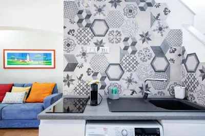 a kitchen with a sink and a couch at Argentina apartment Roof View in Rome