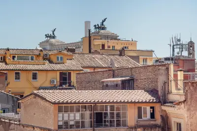 a group of roofs of buildings in a city at Argentina apartment Roof View in Rome