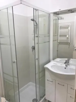 a bathroom with a glass shower and a sink at B&B Palombini in Rome