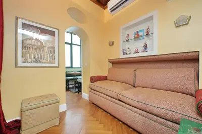 a living room with a couch and a table at Pantheon Luxury Apartment in Rome