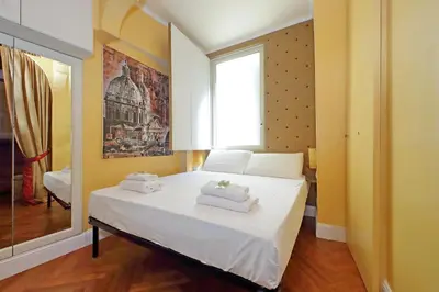 a bedroom with a bed with towels on it at Pantheon Luxury Apartment in Rome
