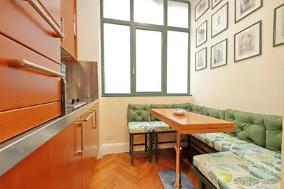 a living room with a couch and a table at Pantheon Luxury Apartment in Rome