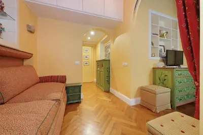 a living room with a couch and a tv at Pantheon Luxury Apartment in Rome