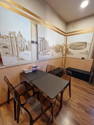 a dining room with a table and chairs at PapavistaRelais in Rome