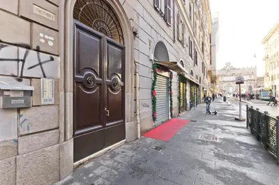 an empty alley with a brown door on a building at Flaminia 36 Luxury Home in Rome