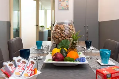 a table topped with a plate of fruit and nuts at Flaminia 36 Luxury Home in Rome