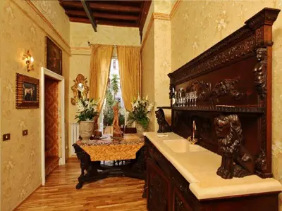 a large bathroom with a sink and a table at Antica Dimora dell'Orso in Rome