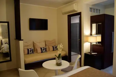 a living room with a couch and a table at Holiday a San Pietro in Rome