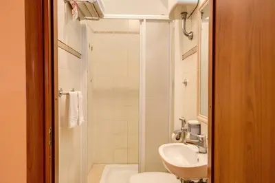 a bathroom with a sink and a toilet and a shower at Giovy in Rome