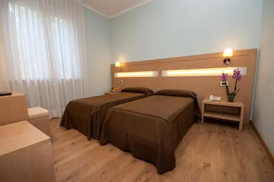 a bedroom with a large bed in a room at Hotel La Pergola in Rome