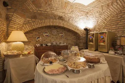 a kitchen with a table with food on it at Hotel Laurentia in Rome