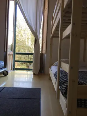 a bedroom with two bunk beds and a balcony at A Casa Di Penelope in Rome