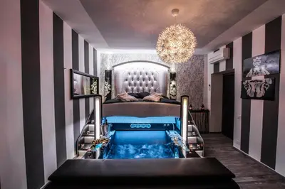 a bedroom with a bed and a swimming pool at Roma d'Amore in Rome
