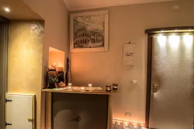 a bathroom with a shelf on the wall at Roma d'Amore in Rome