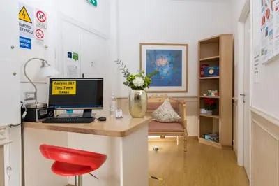 a room with a desk with a computer on it at Aurelia 429 Fine Town House in Rome