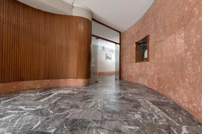 an empty room with a marble floor and brown walls at Aurelia 429 Fine Town House in Rome