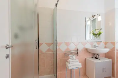 a bathroom with a sink and a shower at Aurelia 429 Fine Town House in Rome