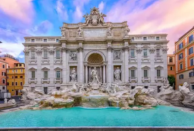 a picture of the trevi fountain in front of a building at Residenza Al Corso Suites in Rome