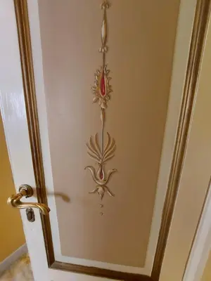 a door with a painting of a fish on it at Residenza Al Corso Suites in Rome