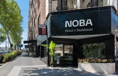 a building with a sign for a hotel and restaurant at Noba Hotel e Residenze in Rome