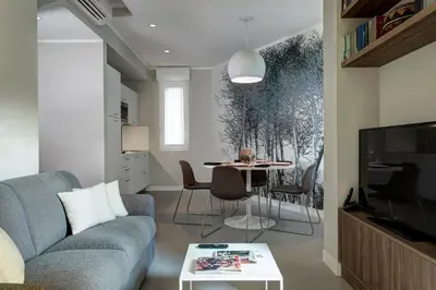 a living room with a couch and a table at Noba Hotel e Residenze in Rome