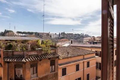 a view of the city from a building at Boutique Domus Trastevere Vascellari in Rome