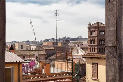 a view of the city from the roof of a building at Boutique Domus Trastevere Vascellari in Rome