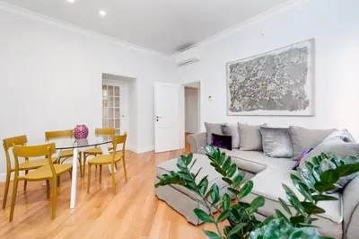 a living room with a couch and a table at Lovatelli Home al Campidoglio in Rome