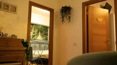 a room with a door leading to a bedroom with a window at Le Quattro Meraviglie in Rome