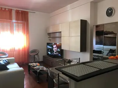 a living room with a couch and a tv at Appartamento S.Giovanni in Rome