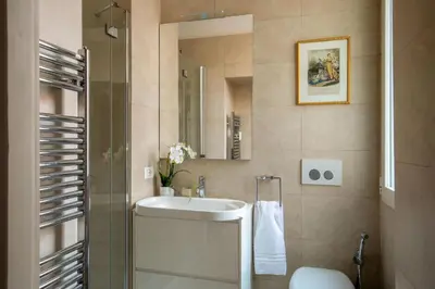 a bathroom with a sink and a mirror at Avignonesi Suites - CA Domus Collection in Rome