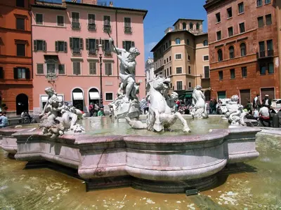a statue of horses in a fountain in a city at Roma Central Studio in Rome