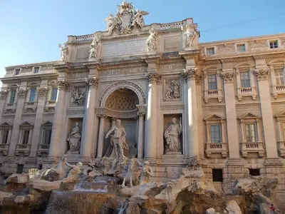 a building with a fountain in front of it at Roma Central Studio in Rome