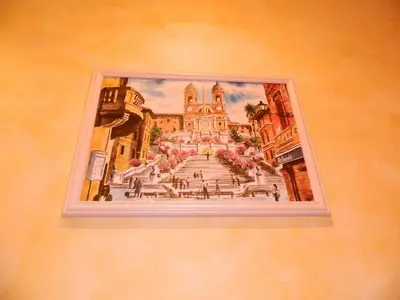 a picture of a painting of a building on a wall at Legends in Rome