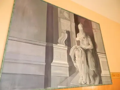 a painting of a statue on the side of a building at Legends in Rome